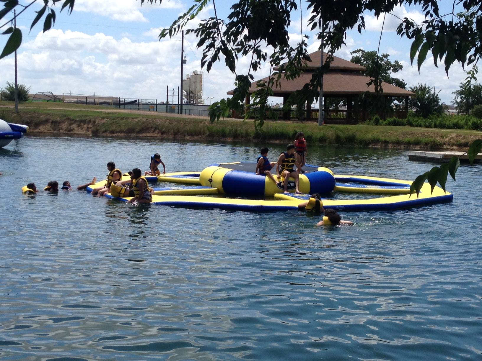 Children enjoy a group water activity outdoors